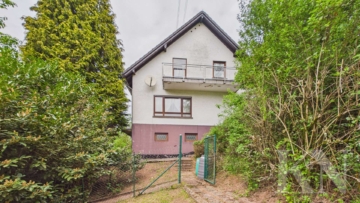 Seitenansicht - Einfamilienhaus mit großem Grundstück und vielseitigem Potenzial