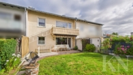 Rückansicht - Ihr neues Zuhause in Riegelsberg – charmantes Einfamilienhaus mit Balkon, Terrasse & Garage!